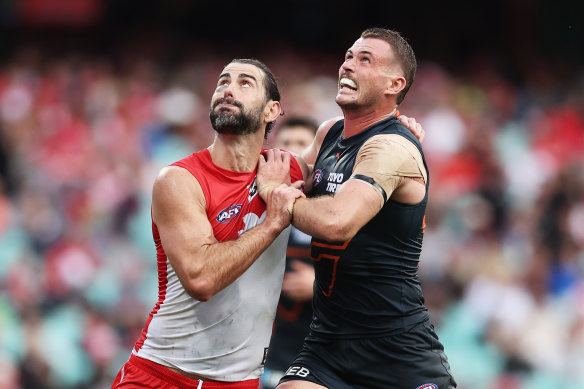 Kieren Briggs of the Giants competes for the ball against Brodie Grundy of the Swans