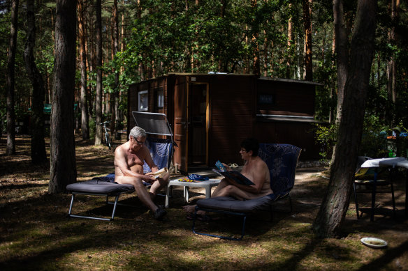 Nudists relax at a camp in Zossen, Germany.