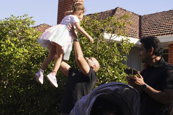 Rizkalla celebrates his auction win with his daughter. 