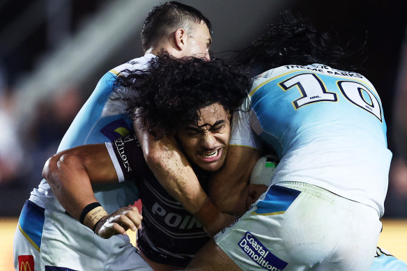 Christian Tuipulotu is tackled. (Photo by Matt King/Getty Images)