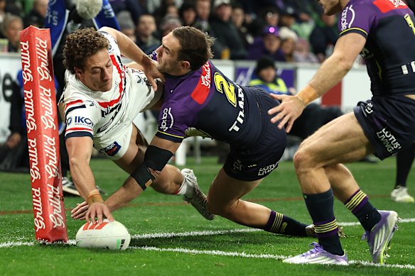 Mark Nawaqanitawase scores one of his four tries for the Roosters against the Storm.
