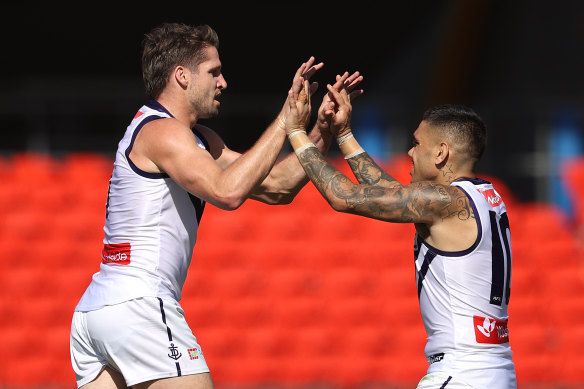 Hogan (left) with Michael Walters before the key forward was traded from Fremantle.