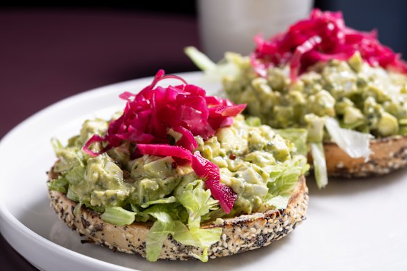 Pesto egg smooshed bagels on the menu.