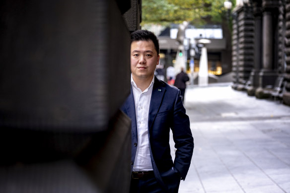 Melbourne City councillor Philip Le Liu was abused while carrying a box of face masks.