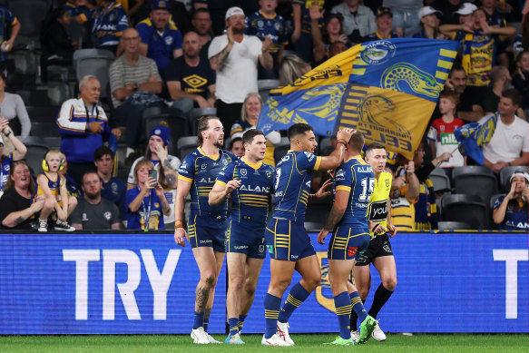 Clint Gutherson celebrates one of his three tries with Eels teammates.