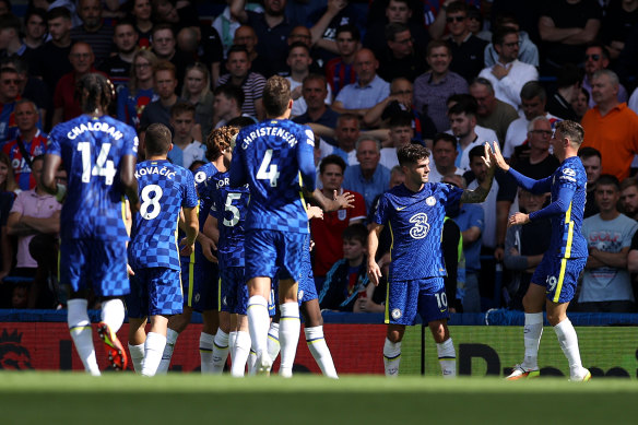 Christian Pulisic celebrates a goal with Chelsea teammate Mason Mount.