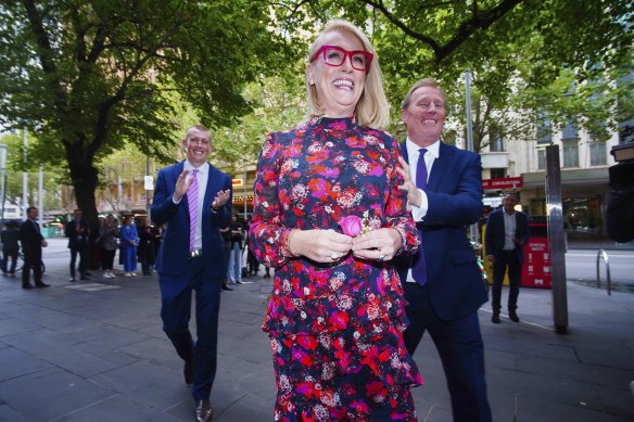 Sally Capp with her husband and son after the press conference during which she announced her upcoming resignation as lord mayor of Melbourne.