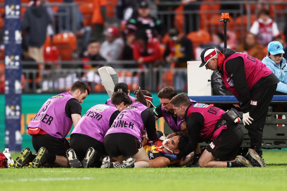 St Kilda’s Mitch Owens receives medical attention after a knock to the head.