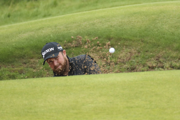 Shane Lowry plays out of a bunker on the 13th green during the final round of the Open at Royal Portrush in Northern Ireland on Sunday.