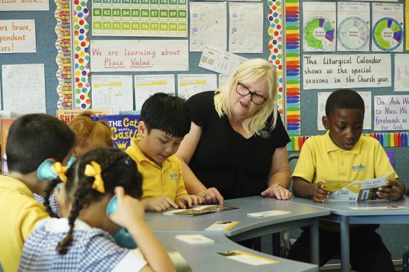 Literacy leader Kirrily Wallace with students at Bethany Catholic Primary School.