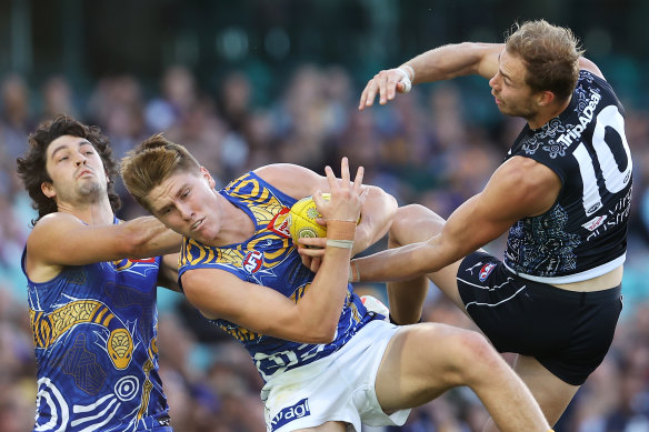 Harry Edwards of the Eagles wins the ball over his namesake, Harry McKay, this season.