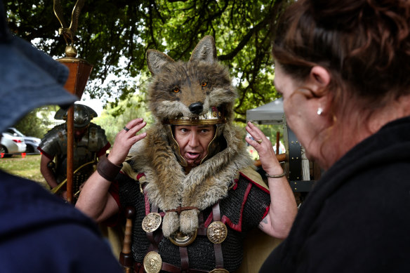 A Roman soldier chats to visitors.