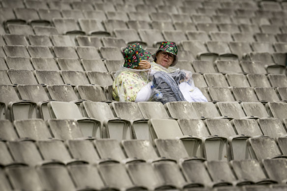 Fan sit through the rain on Boxing Day.