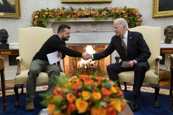 US President Joe Biden shakes hands with Ukrainian President Volodymyr Zelensky in the Oval Office.