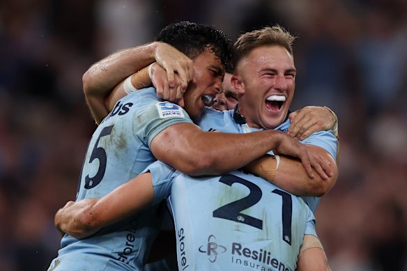 Jack Bowen (right) celebrating a Waratahs win.