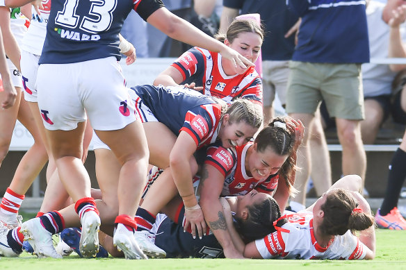 The Roosters celebrate after Yasmine meakes’ try got them back on level terms.