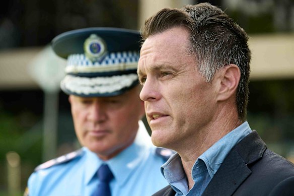 NSW Premier Chris Minns and Police Commissioner Mal Lanyon speak after the rally on Saturday.