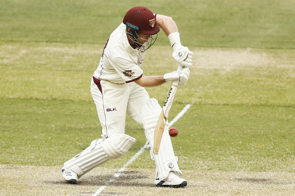 Queensland's Jimmy Peirson bats on day three. 