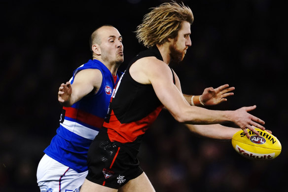 Tory Dickson of the Bulldogs tackles Bomber Dyson Heppell, their only decent player of the night. 