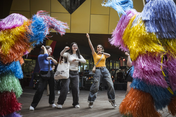 RMIT first-years Alisha Ali, Marianna Mossonidis and Vanessa Jacob enjoying their time at the O-week “street party”.