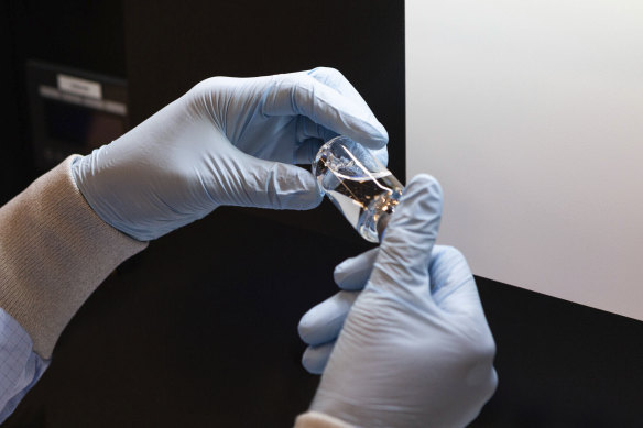 A vial of the drug remdesivir is inspected at a Gilead manufacturing site in the US.