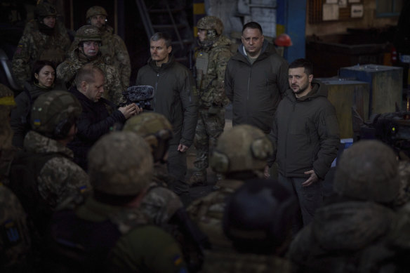 Ukrainian President Volodymyr Zelensky speaks to soldiers at the site of the heaviest battles with the Russian invaders, in Bakhmut, Ukraine.