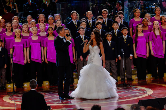 Marina Prior and David Hobson performing at Carols By Candlelight in the Sidney Myer Music Bowl. 