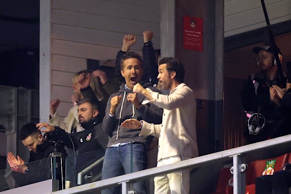 Rob McElhenney and Ryan Reynolds celebrate a Wrexham goal.