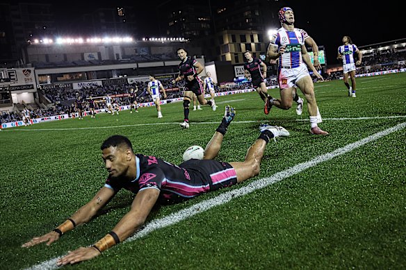 Ronaldo Mulitalo scores for the Sharks, in their Women In League jerseys.