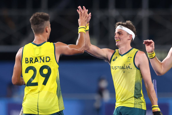 Tim Brand celebrates with teammate Tim Howard after scoring the Kookaburras’ seventh goal during the Men’s Preliminary Pool A match between India and Australia on day two of the Tokyo Olympics.