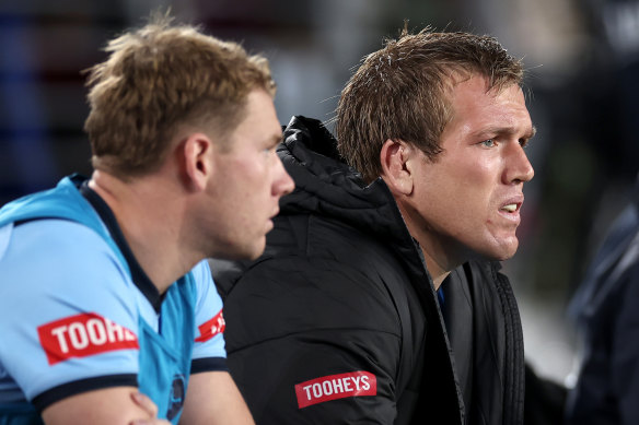 Jake Trbojevic of the Blues looks on from the bench. 