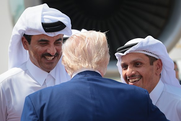 Trump speaking with Emir of Qatar Tamim bin Hamad al Thani (left) and Prime Minister Mohammed bin Abdulrahman bin Jassim Al Thani (right) as he leaves Al Udeid Air Base in May.