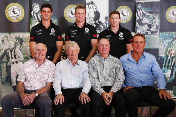 Terry Waters, front left, with Collingwood greats past and present in 2014. 