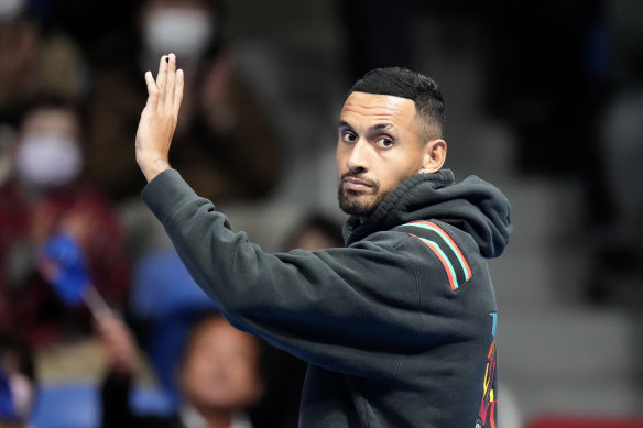 Nick Kyrgios waves after his withdrawal from the Japan Open.