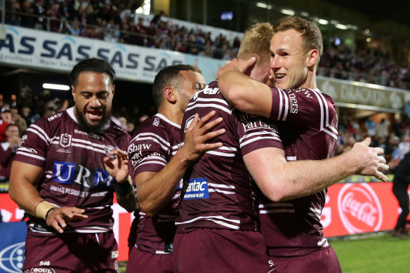 Parker and Cherry-Evans celebrate a try during the 2019 finals series.