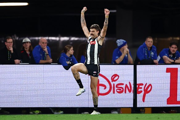 Oleg Markov of the Magpies celebrates a goal.