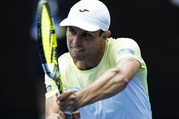 Aleksandar Vukic hits a high backhand in his victory over Sebastian Korda.