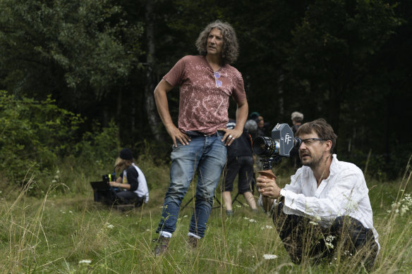 Jonathan Glazer, centre, and Łukasz Ża on the set of The Zone of Interest.