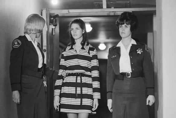 Leslie Van Houten, is escorted by two deputy sheriffs as she leaves the courtroom in Los Angeles, in December 1969.