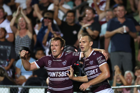 Tom Trbojevic celebrates one of his tries with brother Jake.