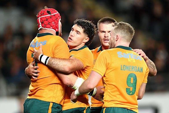 The Wallabies celebrate after Harry Wilson’s try before halftime.