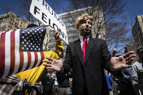 A Donald Trump impersonator appears at a protest across the street from the Manhattan District Attorney’s office in New York.
