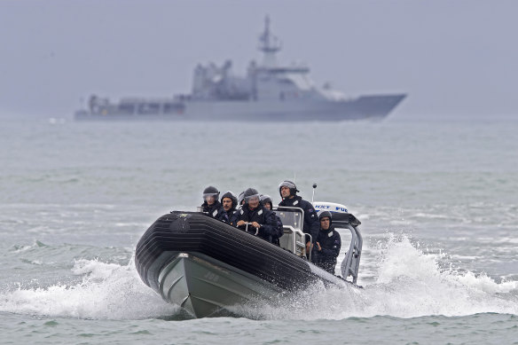 Crew from the HMNZS Wellington return to shore on Monday. Those aboard the ship observed a minute's silence near White Island to mark one week since the eruption.