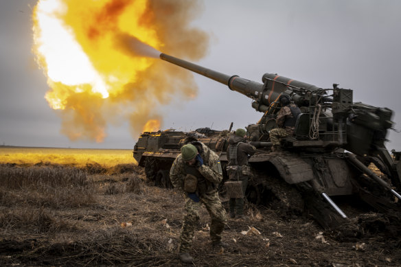 krainian artillerymen fire a 2S7 Pion cannon toward Russian fortifications inside the city of Kreminna.