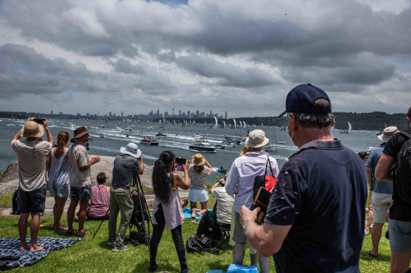A crowd gathers as boats sail past the Hornby Lighthouse at South Head during the start of the Sydney to Hobart yacht race last year.