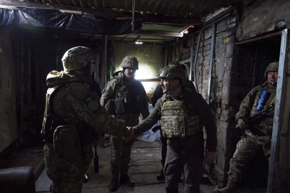 Ukrainian Presidential President Volodymyr Zelensky (right) visits the Donetsk region of eastern Ukraine, which borders Russia.