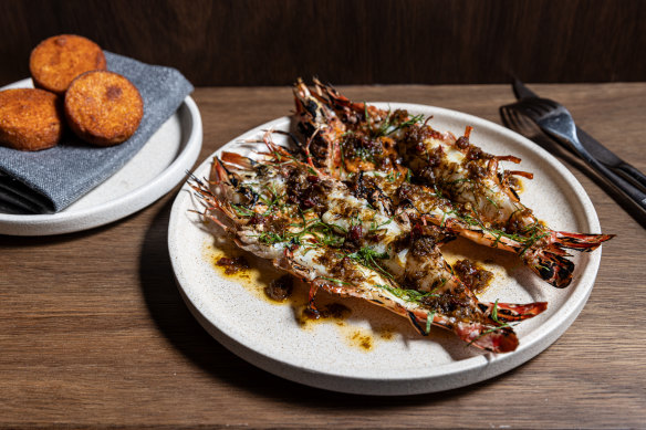 Go-to dish: Tiger prawns, jungle curry, brown butter, pictured with a side of idli (steamed rice and lentil cakes).