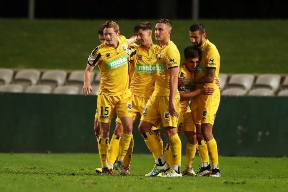 Dylan Ruiz-Dias (centre) celebrates with his teammates after scoring a goal against Melbourne Victory.