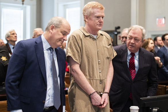 Alex Murdaugh speaks with his legal team before he is sentenced.