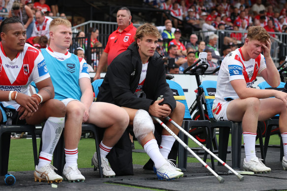 Ryan Couchman watches on the sideline after suffering a suspected ACL injury.